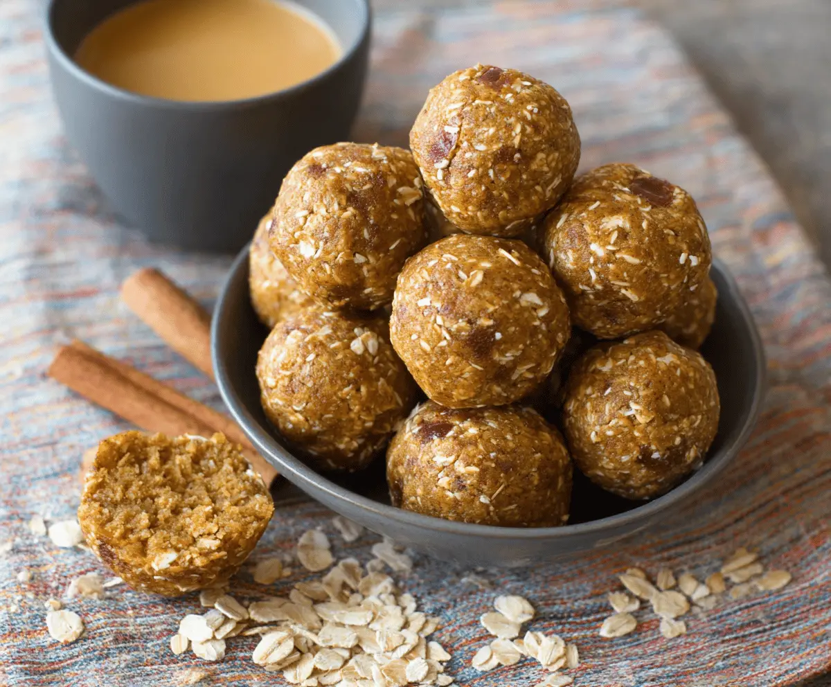 Delicious homemade Apple Cinnamon Pumpkin Protein Balls on a white plate, showcasing a healthy, energy-boosting snack with autumn flavors