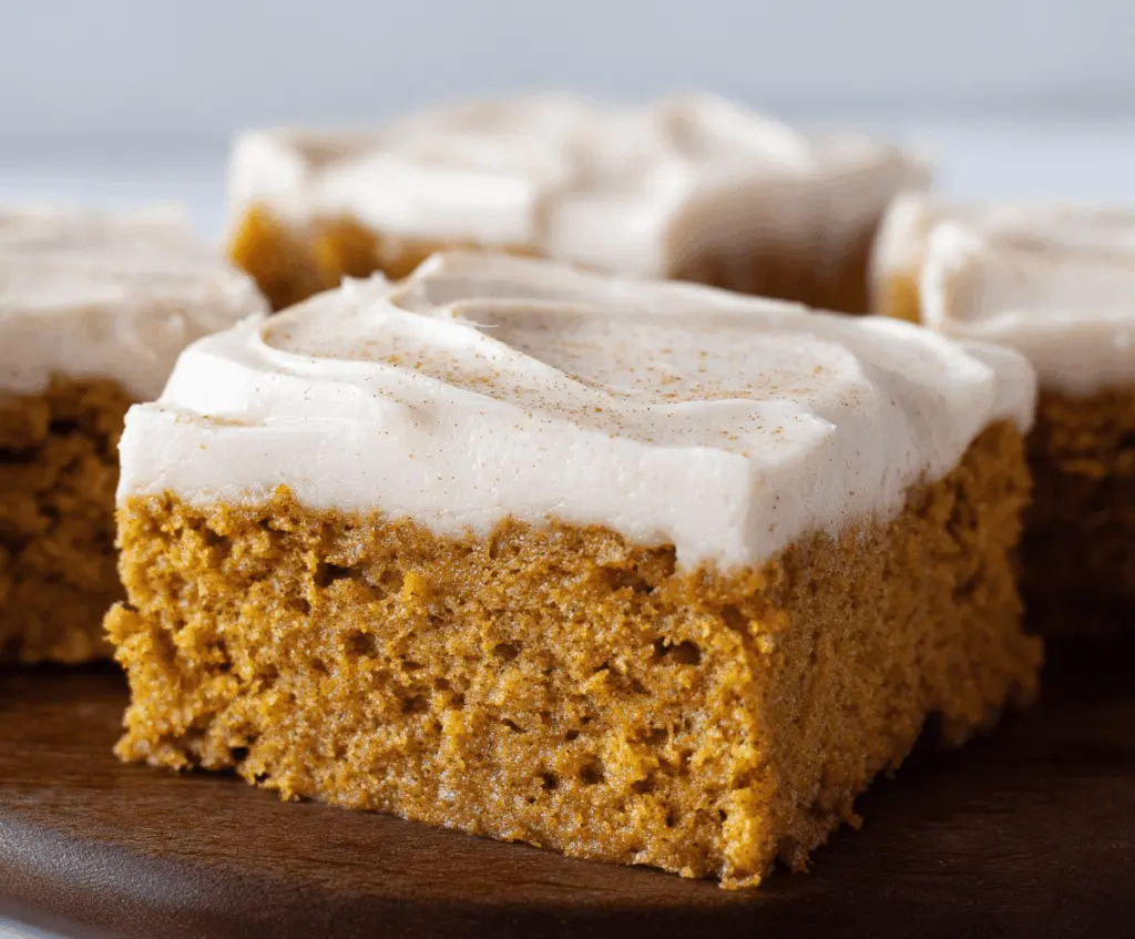Delicious homemade pumpkin bars topped with creamy brown sugar frosting, perfect for fall dessert or holiday gatherings.