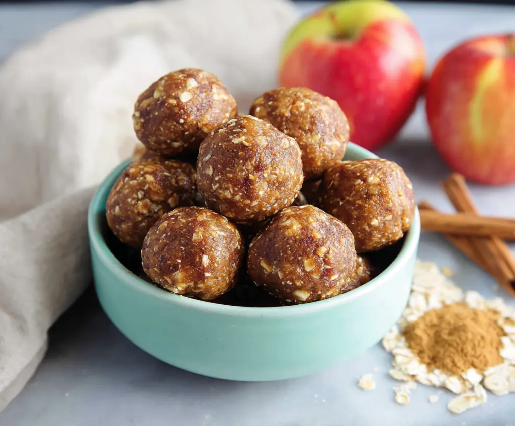 Delicious Apple Pie Protein Bites in a bowl, showcasing a healthy, high-protein snack with apple pieces and crunchy coating.
