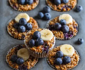 Healthy blueberry banana baked oatmeal cups in a baking dish ready to serve