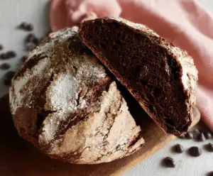 Homemade chocolate sourdough discard bread with a crispy crust and a rich, chocolatey interior.