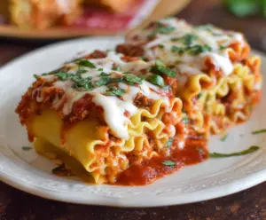 Delicious homemade Lasagna Roll Ups with melted cheese and rich tomato sauce.