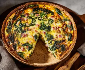 Delicious Easter ham and spinach quiche ready to serve for holiday brunch.